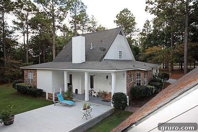 Cotton State Farmhouse 17 The back porch and patio area before enhancements for outdoor living