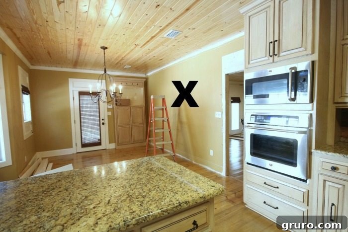 Cotton State Farmhouse 19 Kitchen wall being removed to create a more open concept space in the Alabama Farmhouse
