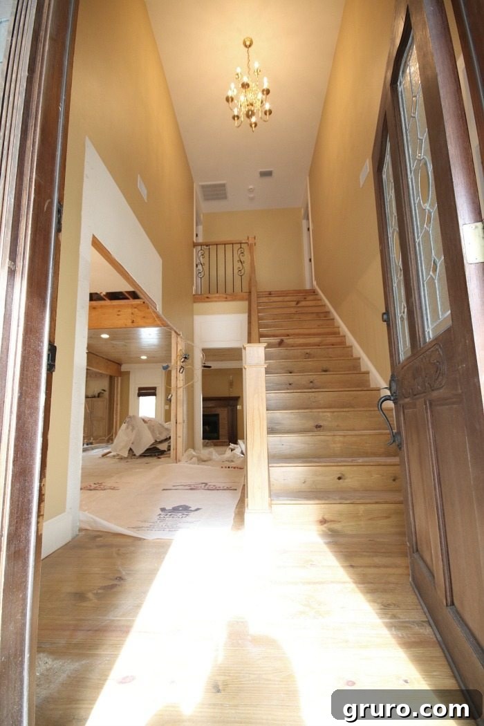 Cotton State Farmhouse 20 Entryway after walls removed, before finishing and painting at Alabama farmhouse