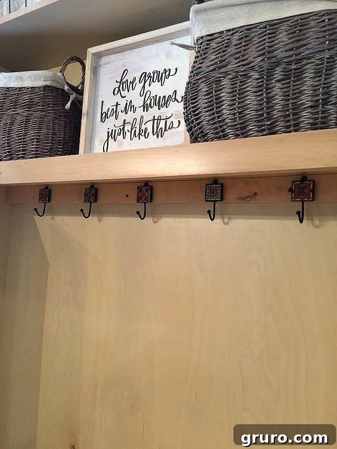 Smart Mudroom Storage 11 The transformed TV cabinet, now functioning beautifully as a mudroom closet with added shelving