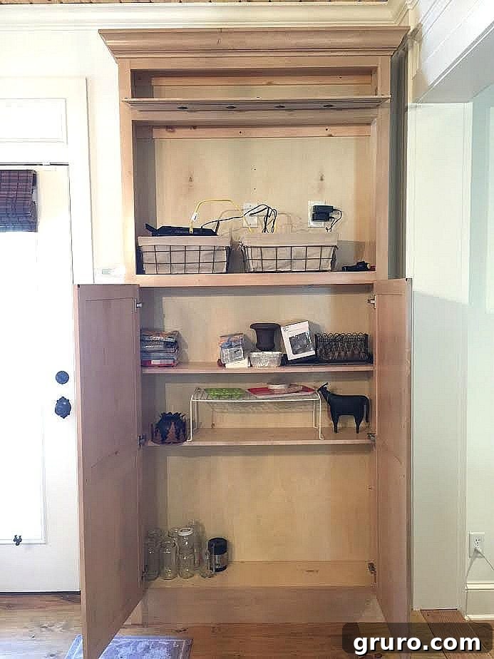 Smart Mudroom Storage 3 Before: A bulky former TV cabinet awaits transformation into a functional mudroom drop zone