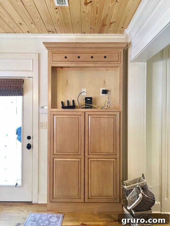 Smart Mudroom Storage 4 Before: The interior of the old TV cabinet, showing its previous layout prior to mudroom conversion