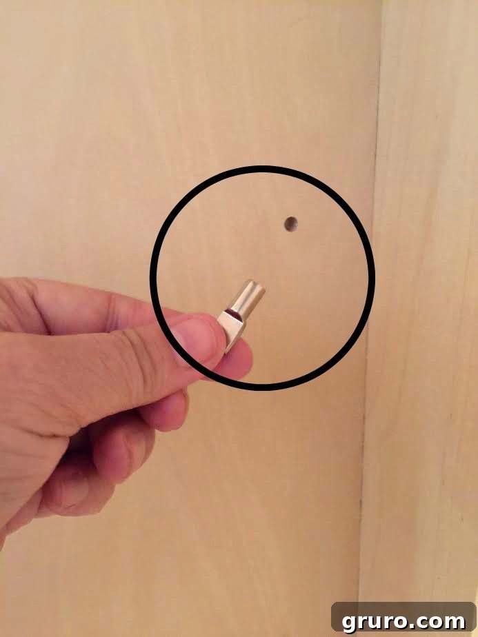 Smart Mudroom Storage 9 Close-up of perfectly drilled shelf peg holes, ready for pins, achieved with the Kreg jig