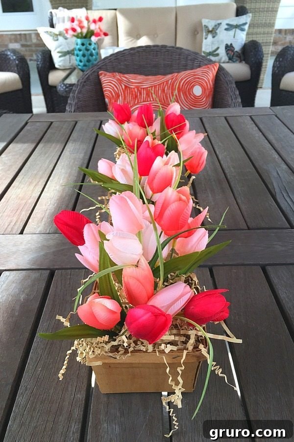 Farmhouse Spring centerpiece with pretty tulips ready for outdoor dining
