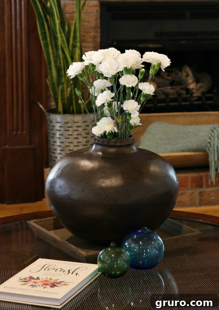 Beautiful handmade clay pottery water jug, a cherished gift from Mama, displayed in the farmhouse living room.