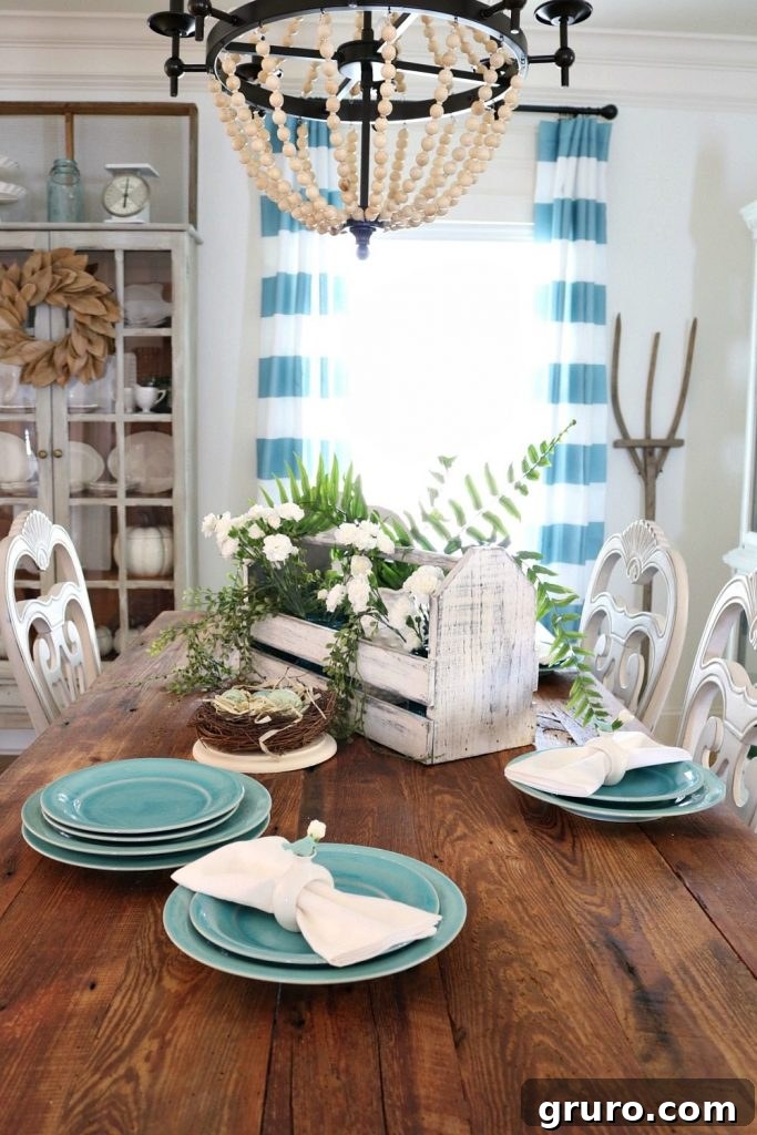 Aqua and turquoise hues create a fresh, vibrant, and inviting atmosphere in the spring dining room.