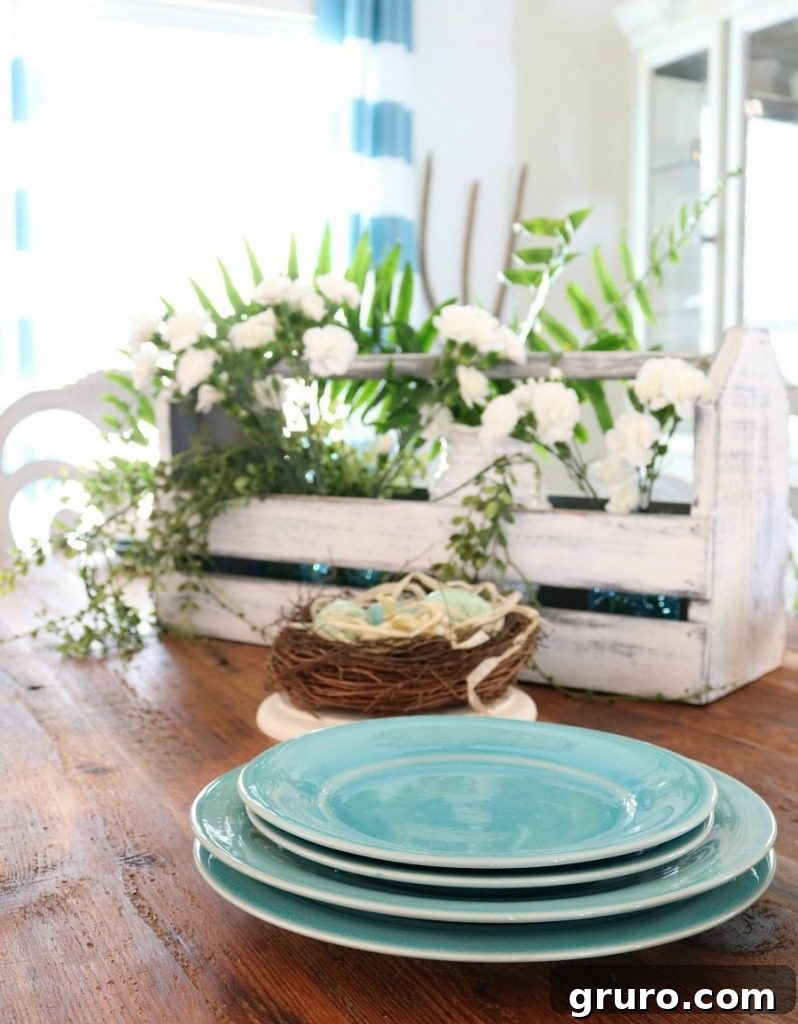 Beautiful turquoise dinnerware arranged for a charming spring table setting, adding a pop of color.