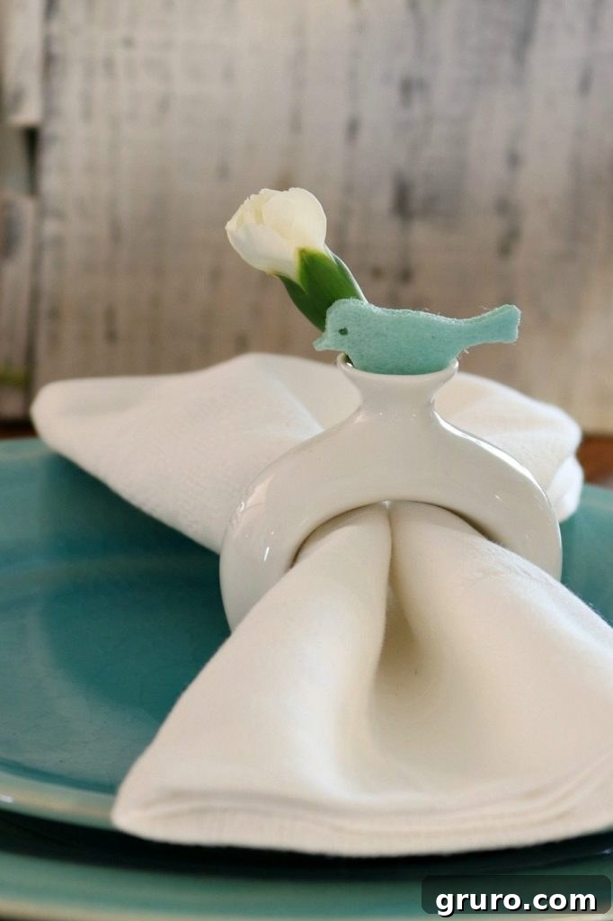 Charming buds and birds adorn napkin rings, adding a sweet and seasonal touch to the spring table.