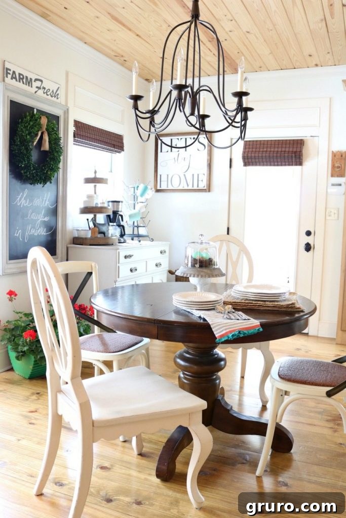 A cozy eat-in kitchen featuring a chalkboard farm sign, rustic wood floors, and a charming wood ceiling.