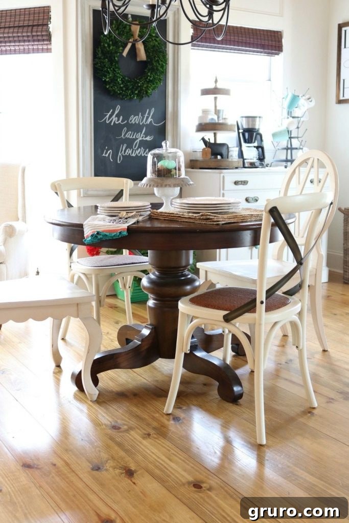 A charming Pottery Barn kitchen table adorned with simple, fresh spring decor elements.