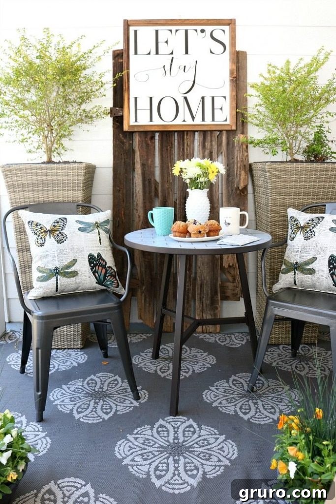 A beautifully refreshed farmhouse porch, ideal for enjoying breakfast or happy hour in a relaxed setting.
