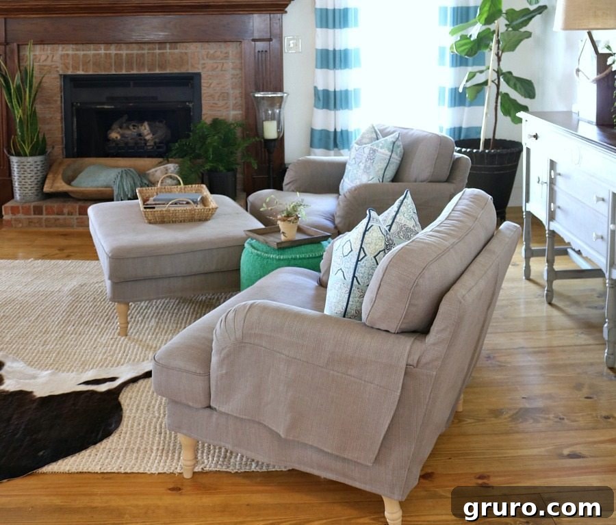 Wide view of a comfortable farmhouse living room decorated for spring, featuring a fireplace and inviting seating.