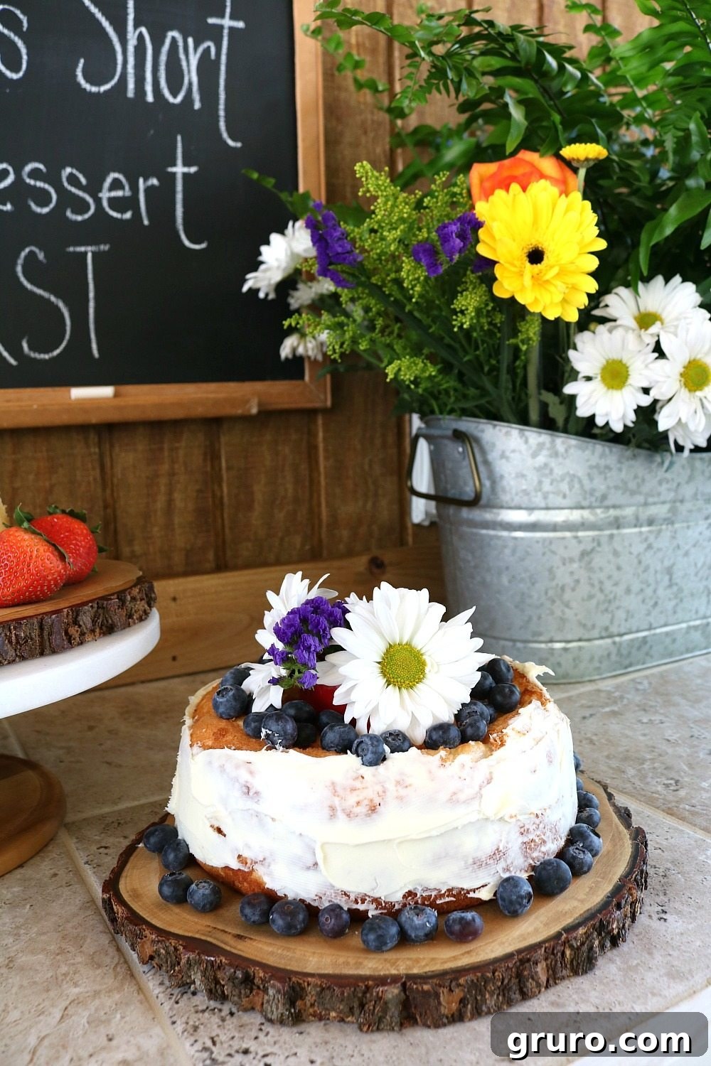 Streamlined Style, Supreme Outdoor Comfort 14 Farmhouse desserts served on wood slices with flowers in a galvanized tub, creating a charming display.