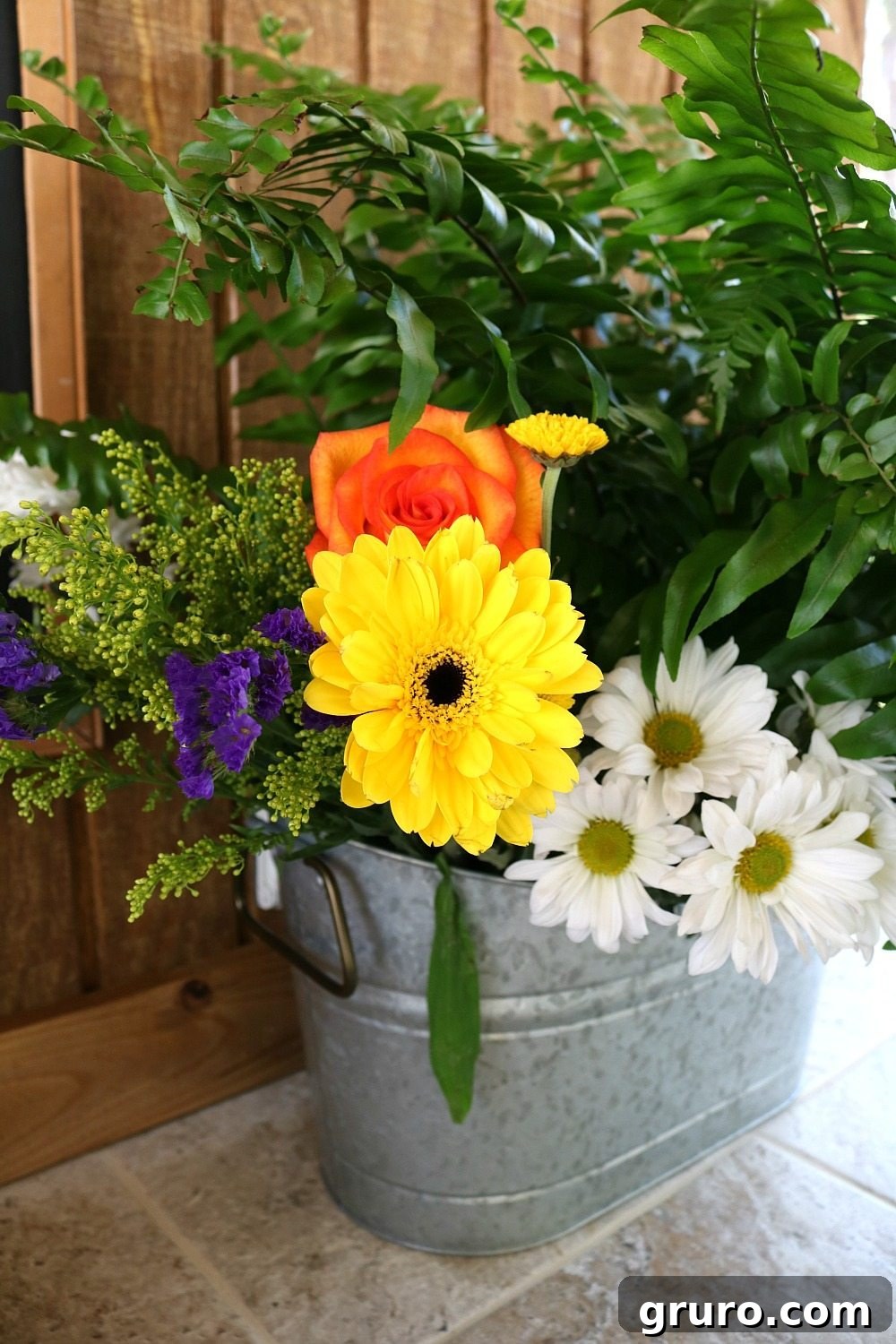 Streamlined Style, Supreme Outdoor Comfort 15 Farmhouse flowers in a galvanized bucket, perfect for any decor style.