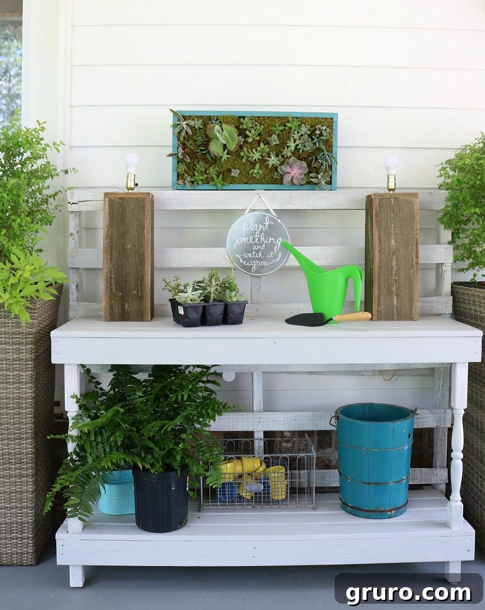 Succulent Wallscapes 8 Vertical succulent garden mounted above a potting table made from pallets, perfect for a back porch