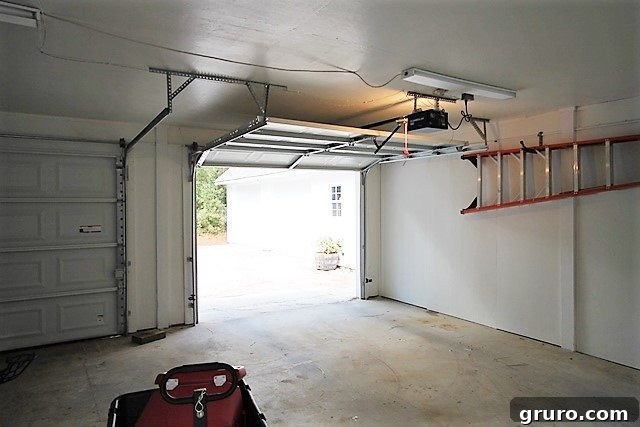 Rustic Retreat: Design and Layout 4 Garage before renovation, showing exterior view