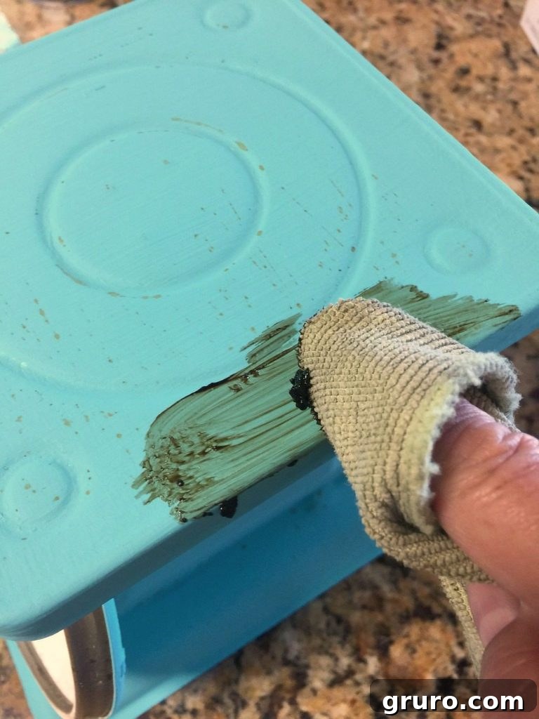 Revitalizing Vintage Kitchen Scales 8 Dark wax used to finish a metal piece, creating an aged patina
