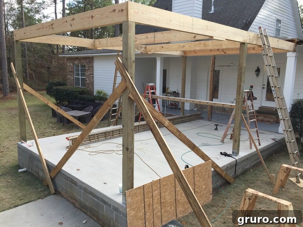 Crafting Your Backyard Culinary Retreat 5 Posts up just the beginning of a roof over the patio at Refresh Restyle