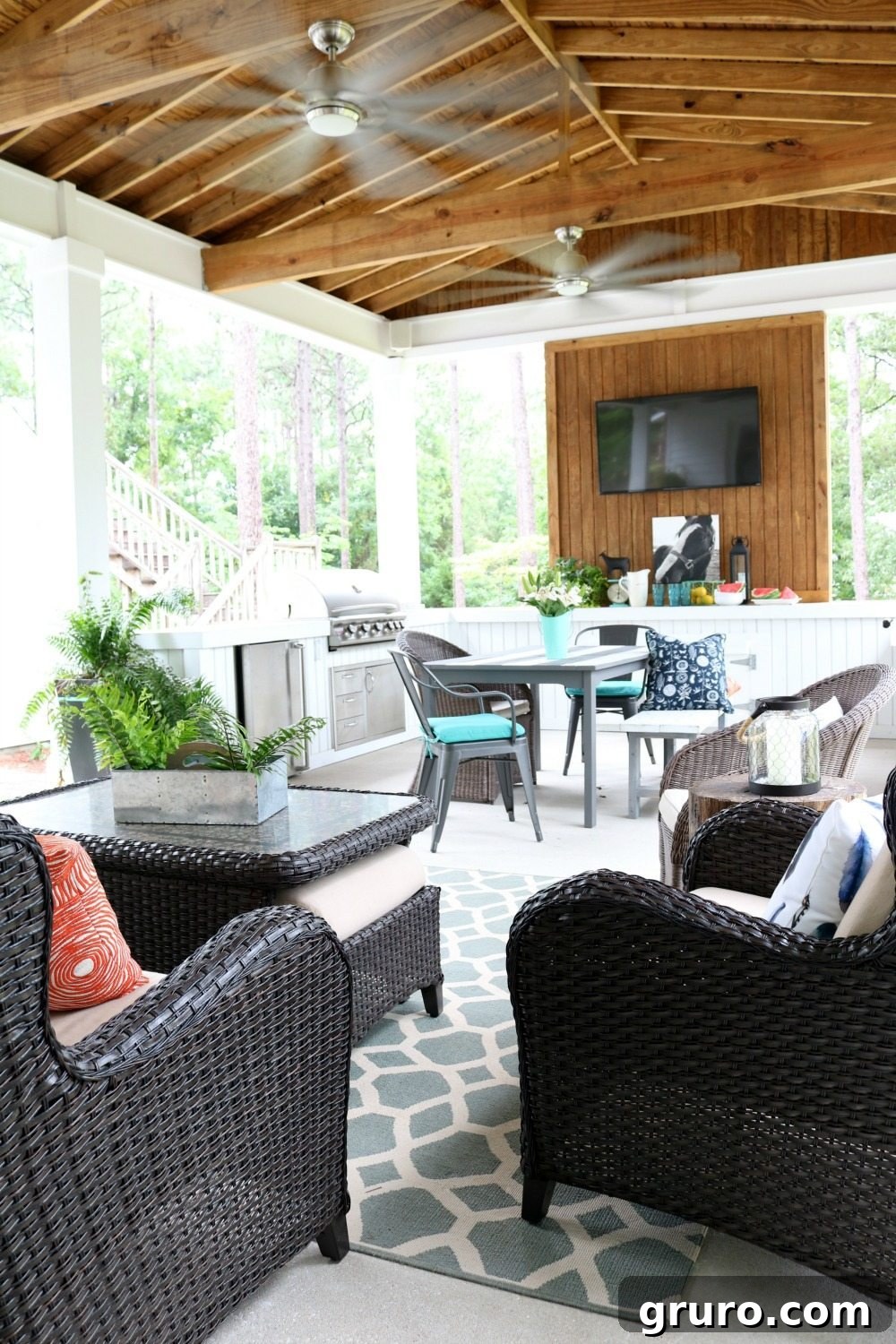 Full view of a beautifully designed outdoor kitchen on a farmhouse summer porch