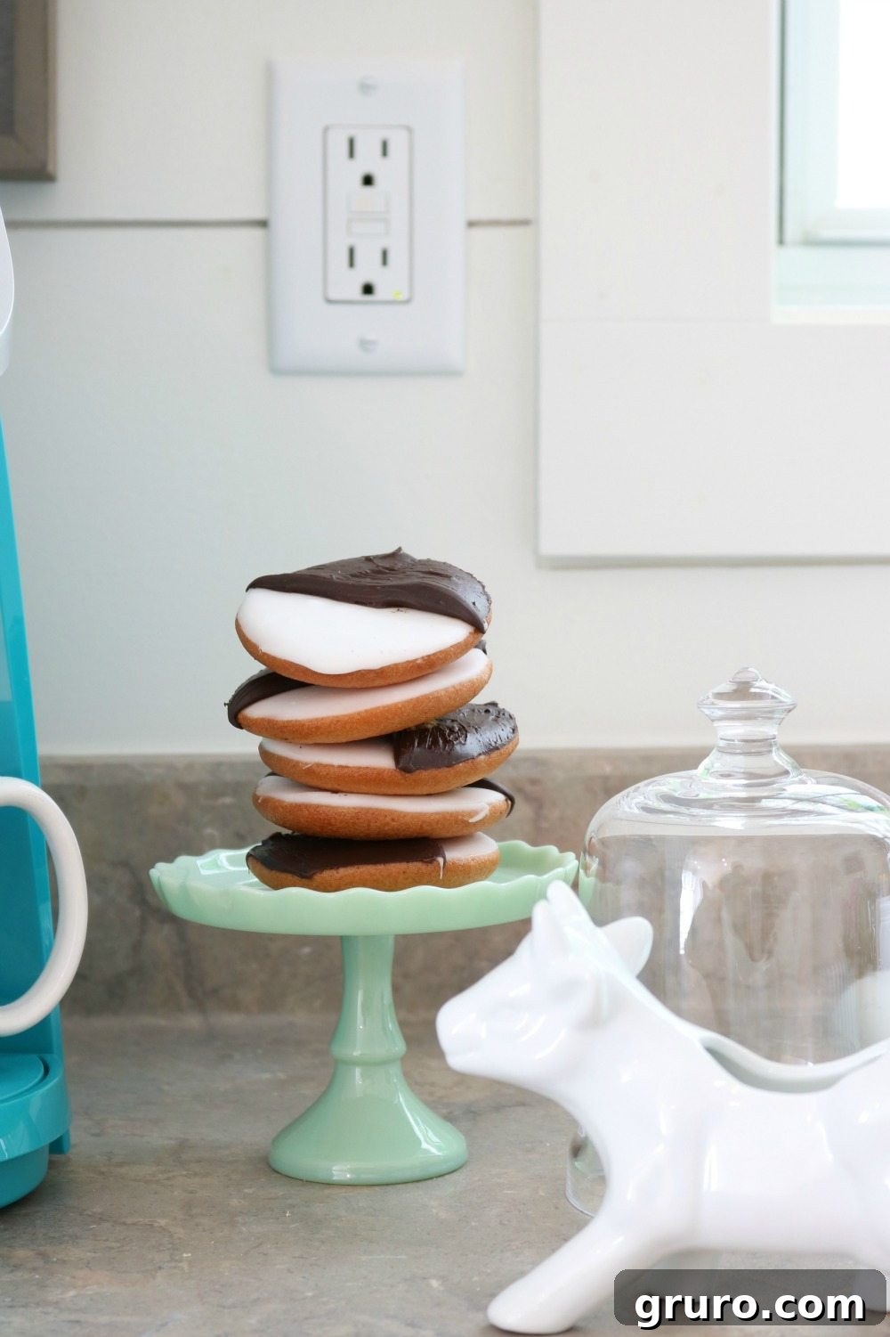 A cup of coffee perfectly paired with a delicious sweet treat, embodying a moment of relaxation and simple indulgence.