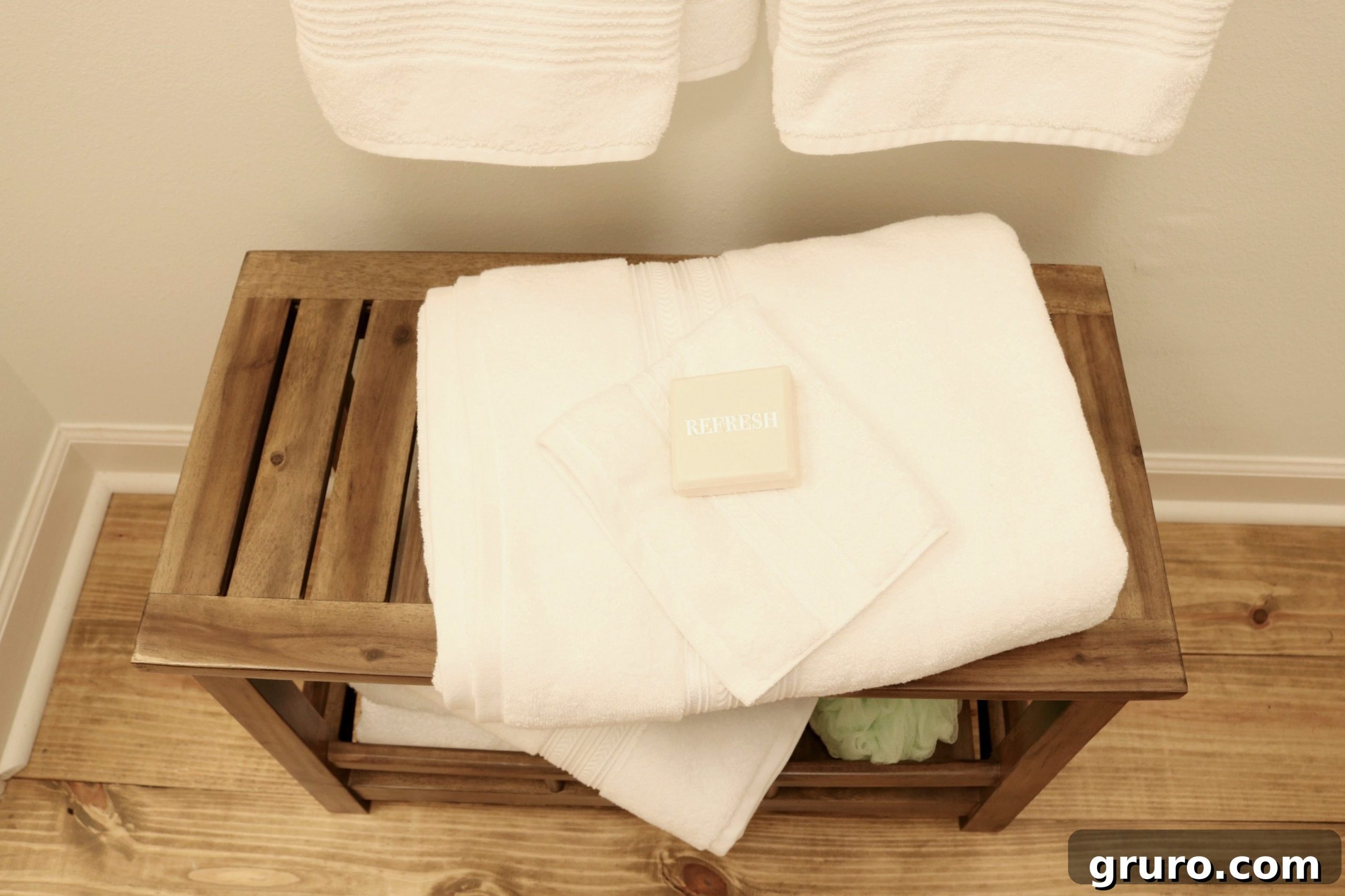 Farmhouse Guest Bathroom Makeover 19 Plenty of White Towels and Sweet Smelling Soap for a Minimalist Farmhouse Bath