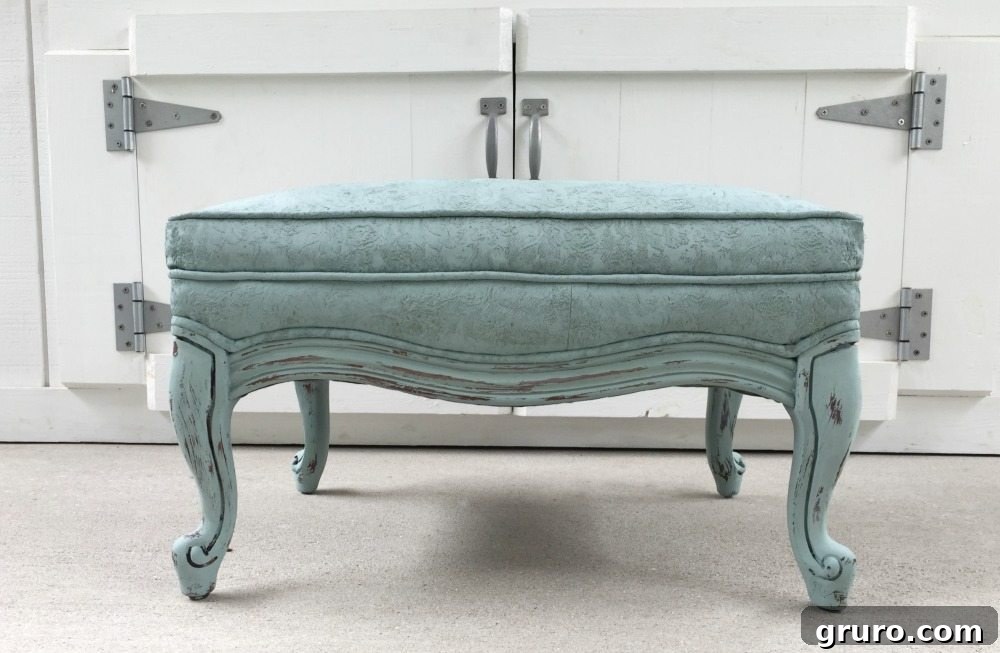 Duck Egg Blue painted fabric on a thrift store ottoman, showcasing a beautiful DIY furniture makeover