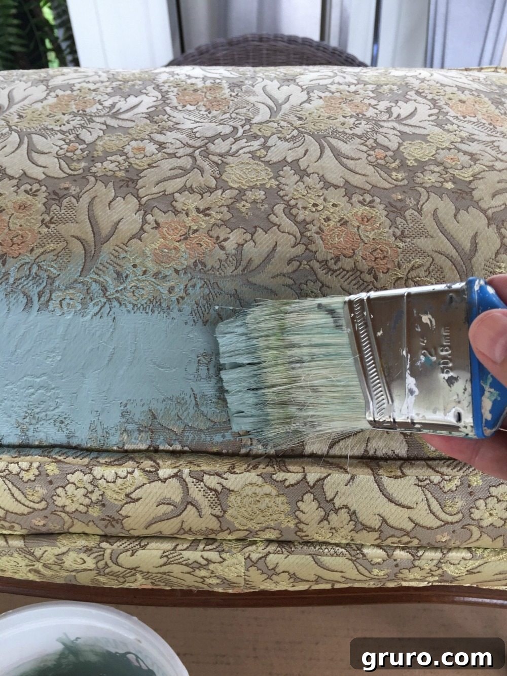 Applying two thin coats of chalk paint mixed with fabric medium for painting upholstery