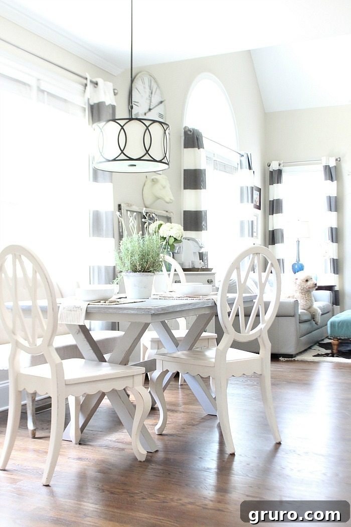 Farm-table-painted-gray-with-x-base-love-the-light-and-bright-dining-area