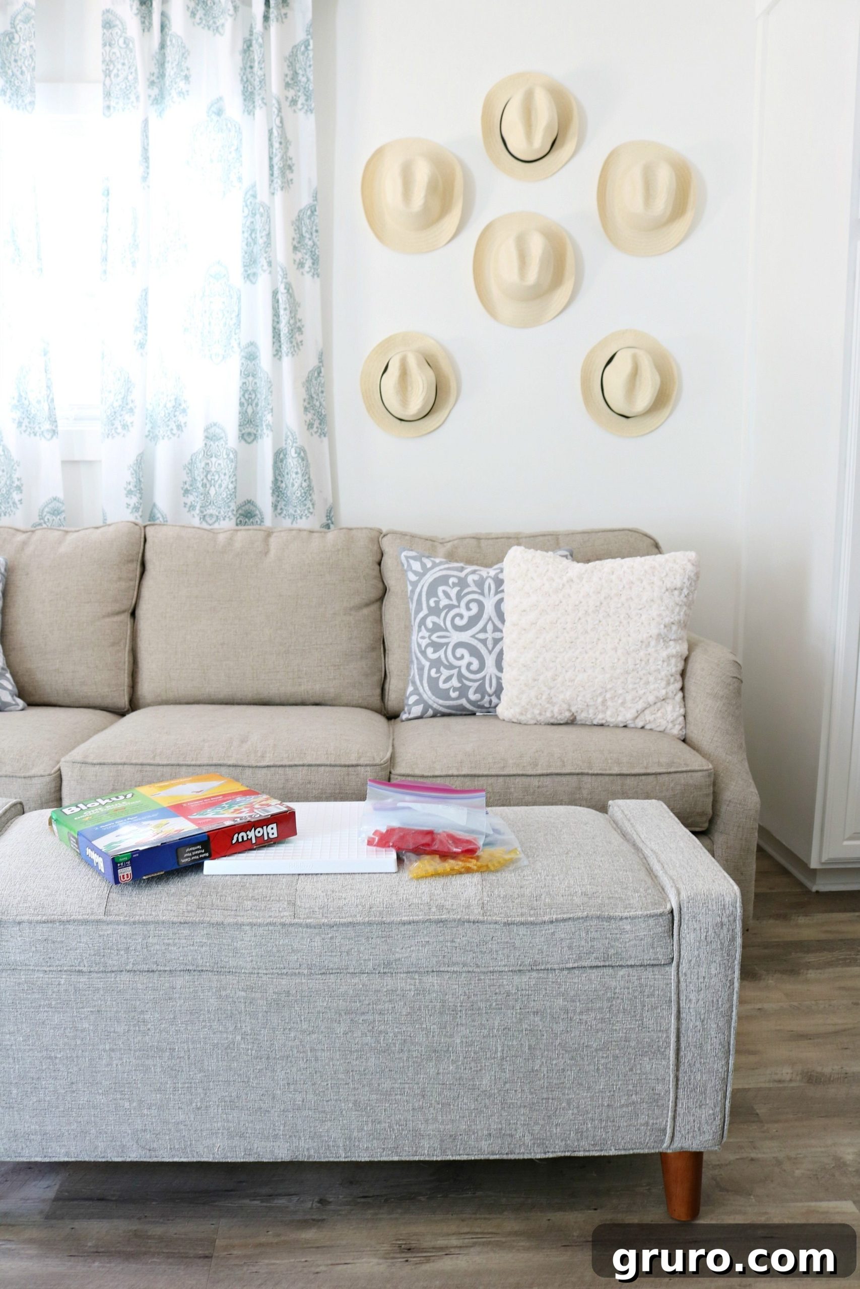 A harmonious blend of warm grays and minimalist decor creates a serene small living room