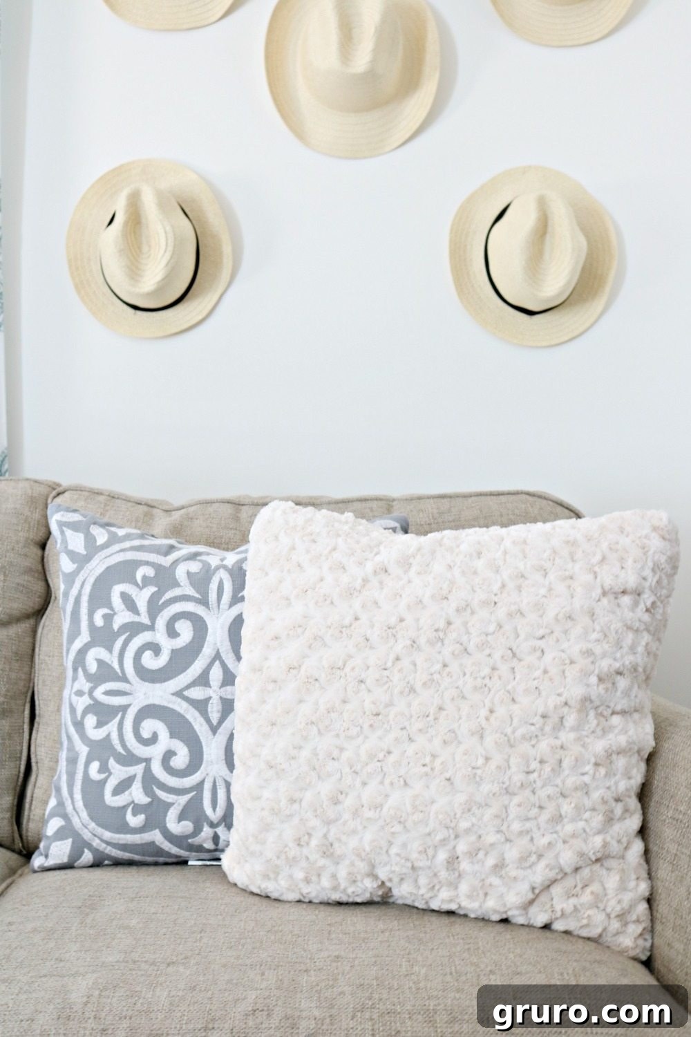 A curated mix of pillows, adding texture and subtle color to the living space