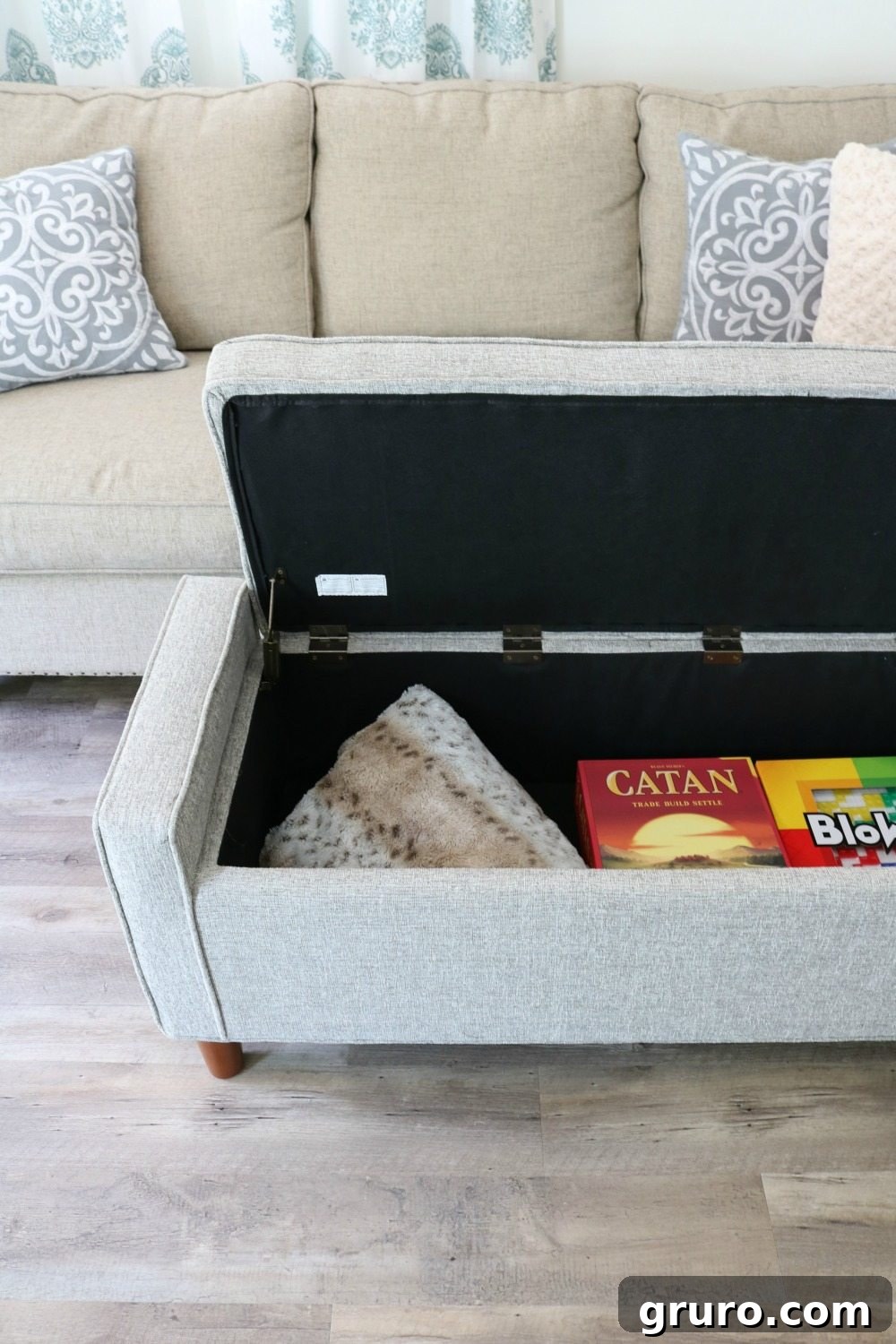 Multi-functional storage bench acts as a living room ottoman in a tiny home setup