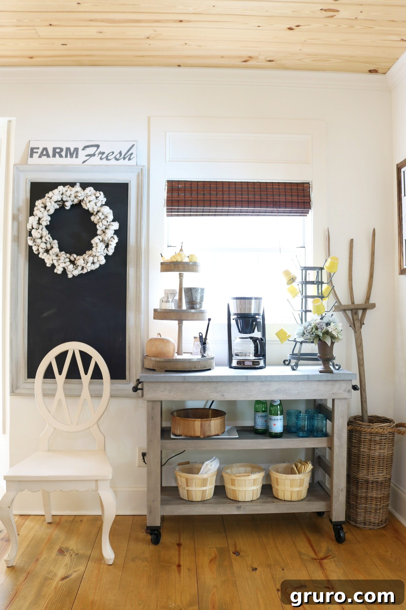 Farmhouse cart styled as a coffee station, featuring fall decor elements in the kitchen.