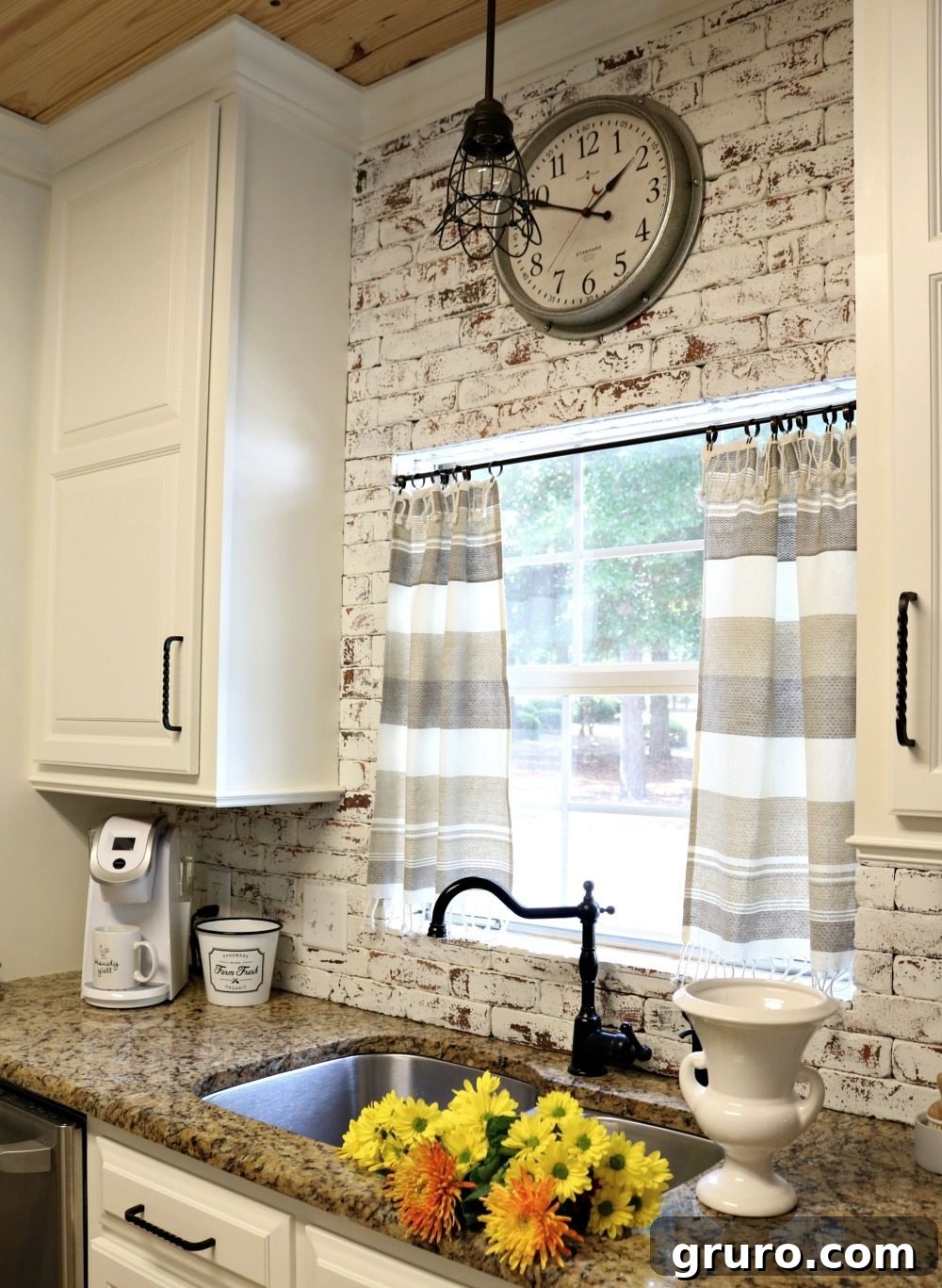 Colorful fall mums adding a vibrant touch to the farmhouse kitchen decor.