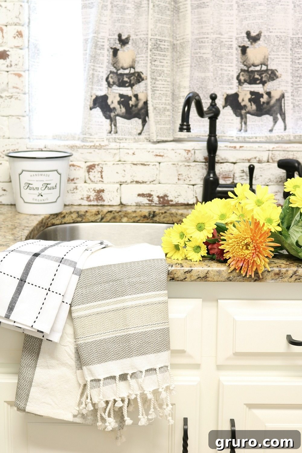 Farmhouse kitchen featuring painted brick, dish towel curtains, and cozy fall details at Refresh Restyle.