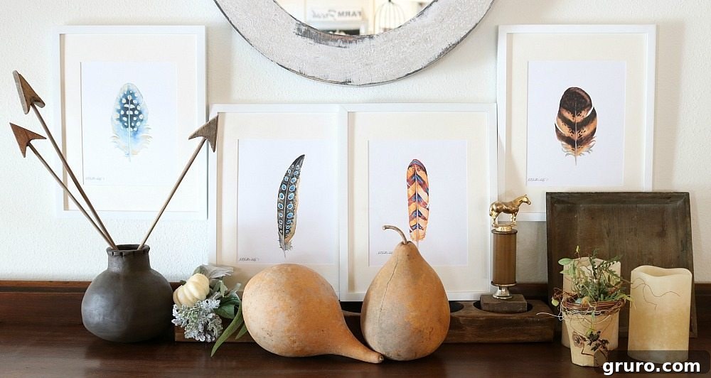 Feather prints framed in white, thoughtfully arranged as part of elegant fall decor.