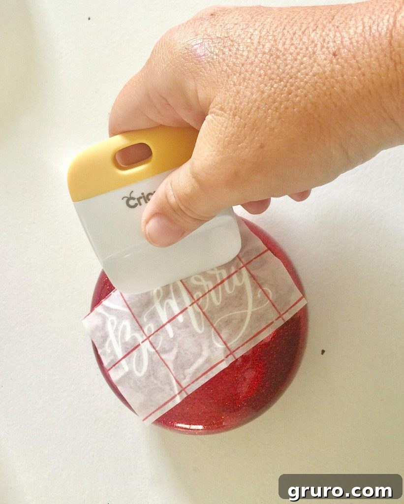 Apply vinyl to glitter Christmas ornaments steps