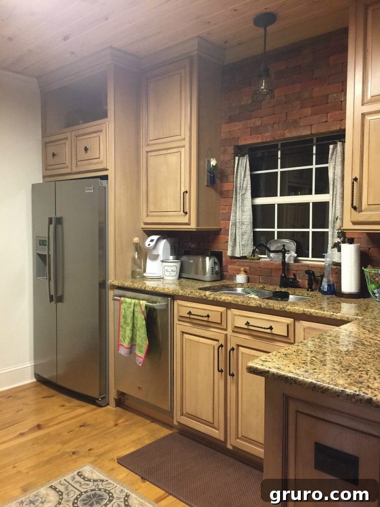 Before the brick backsplash and cabinets were painted