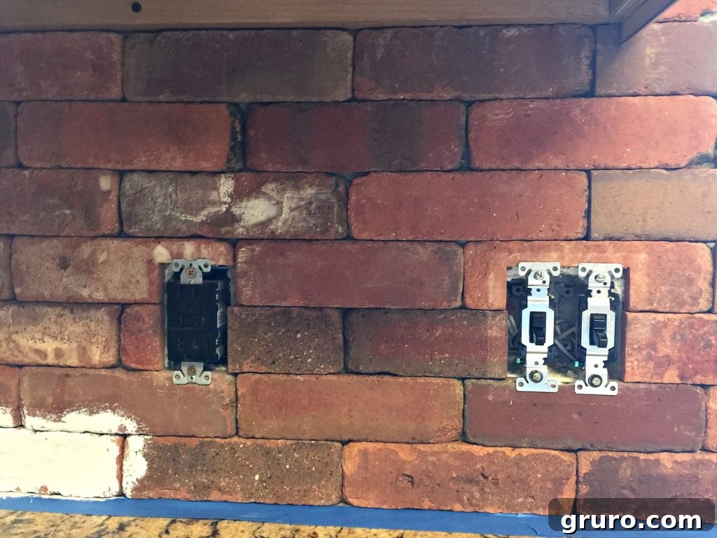 Step-by-step: Remove switch covers and tape off areas before painting brick