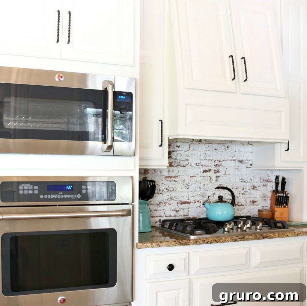 Painted brick and cabinet with Sherwin Williams Dover White for a bright kitchen