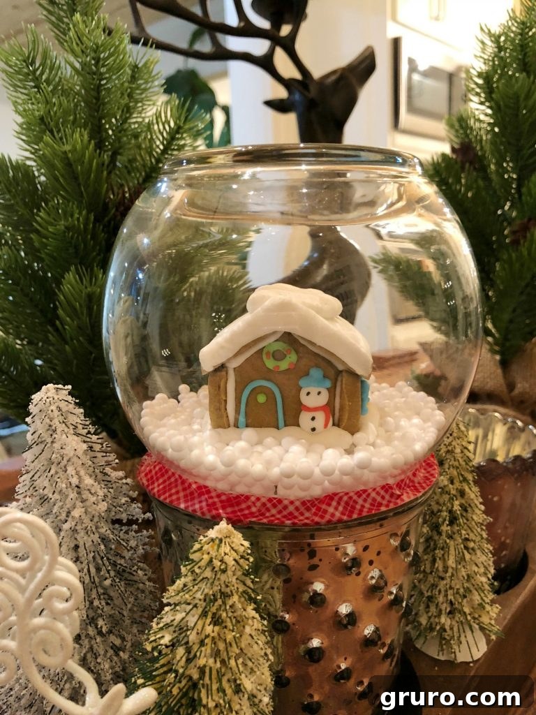 Whimsical Gingerbread Snow Globe 3 Gingerbread house snow globe for a festive Christmas table setting