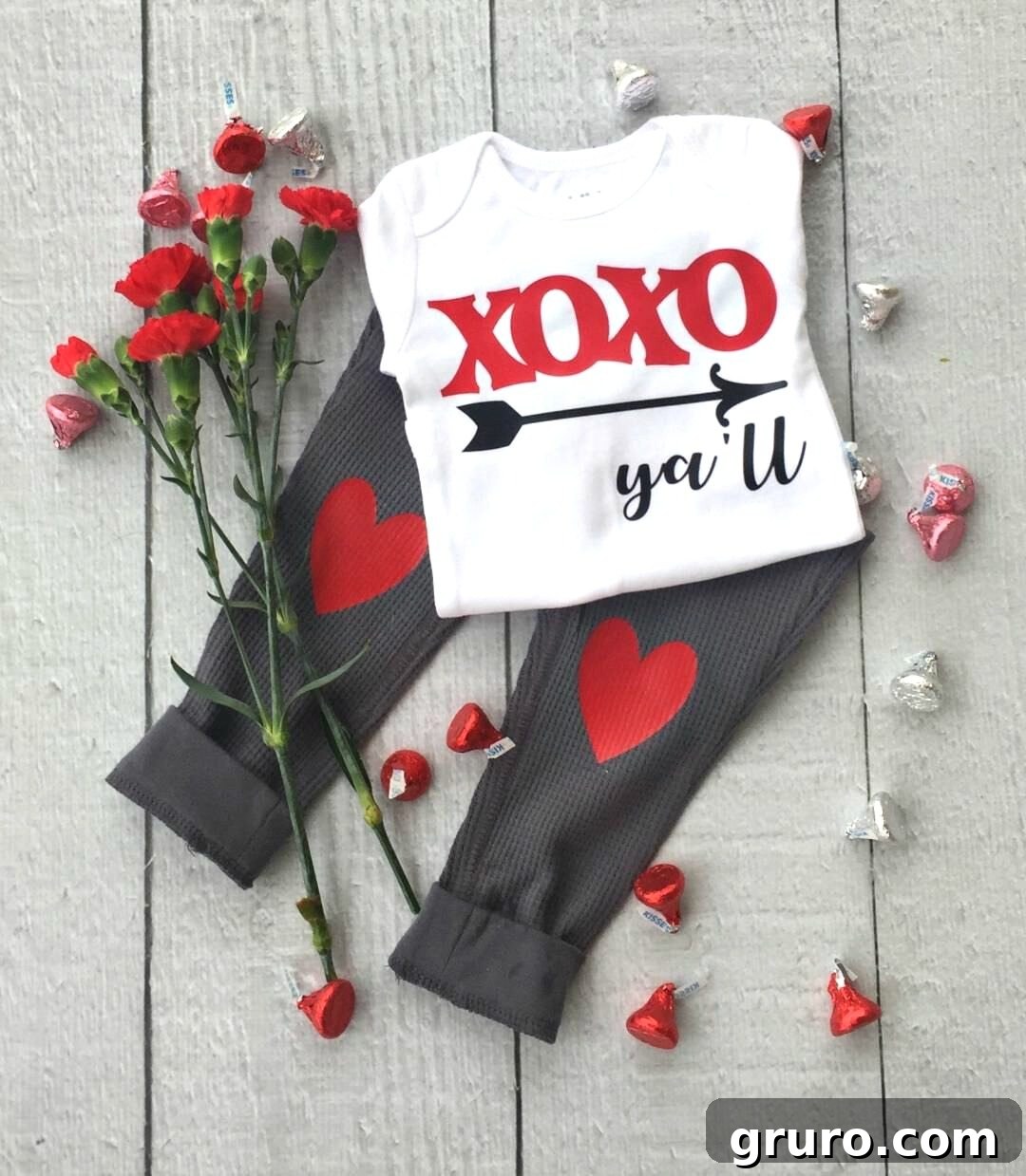 Romantic Valentine's Day Styles 2 Adorable baby wearing a custom Valentine's Day onesie and heart-patch pants