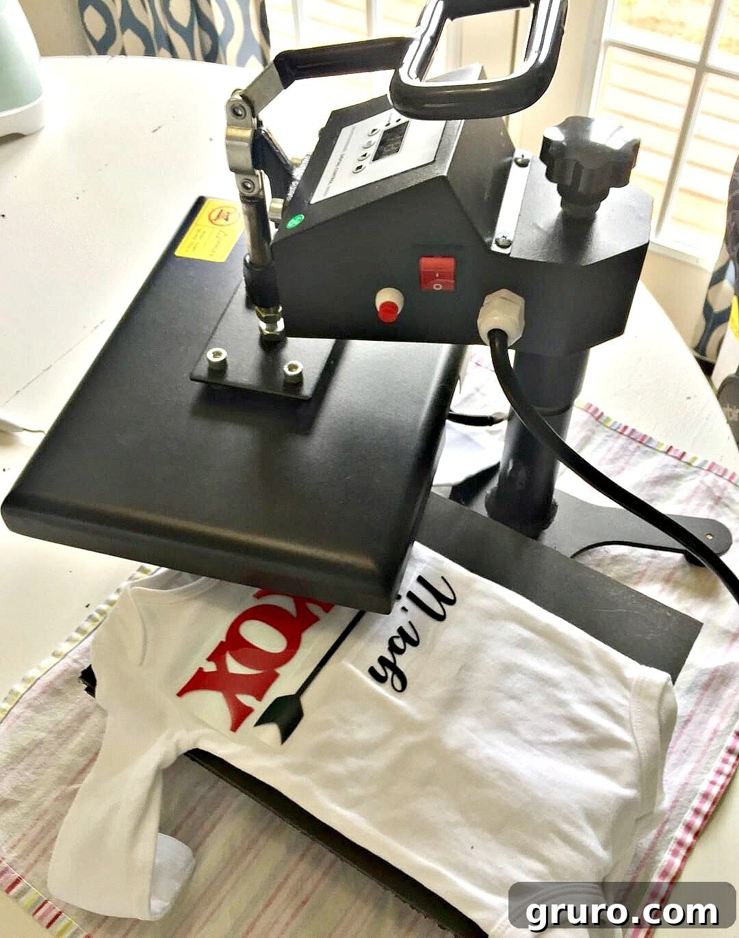 Romantic Valentine's Day Styles 8 Using a heat press machine to apply heat transfer vinyl onto a baby garment