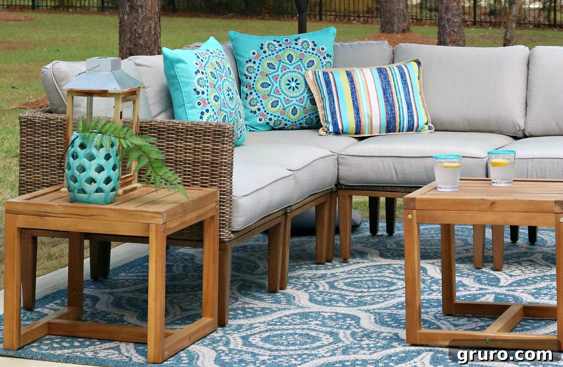 Colorful pillows and lush greenery creating a vibrant outdoor setting.