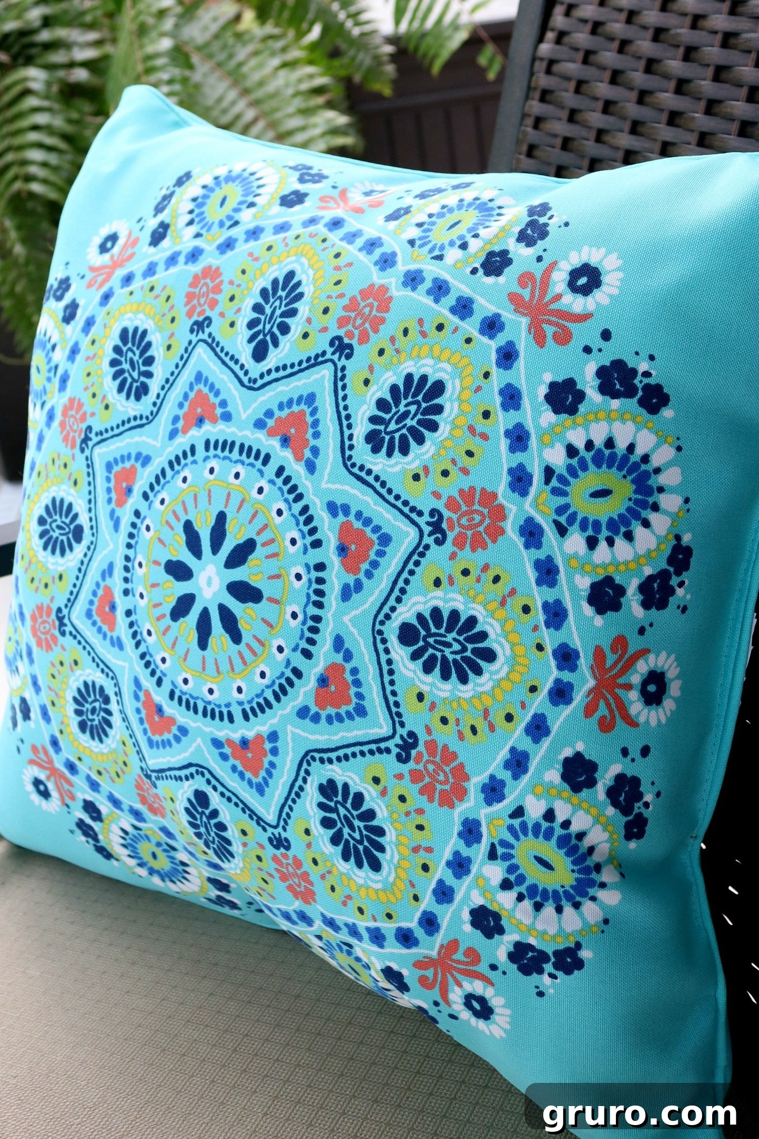 Close-up of an outdoor pillow showcasing its rich texture and design.