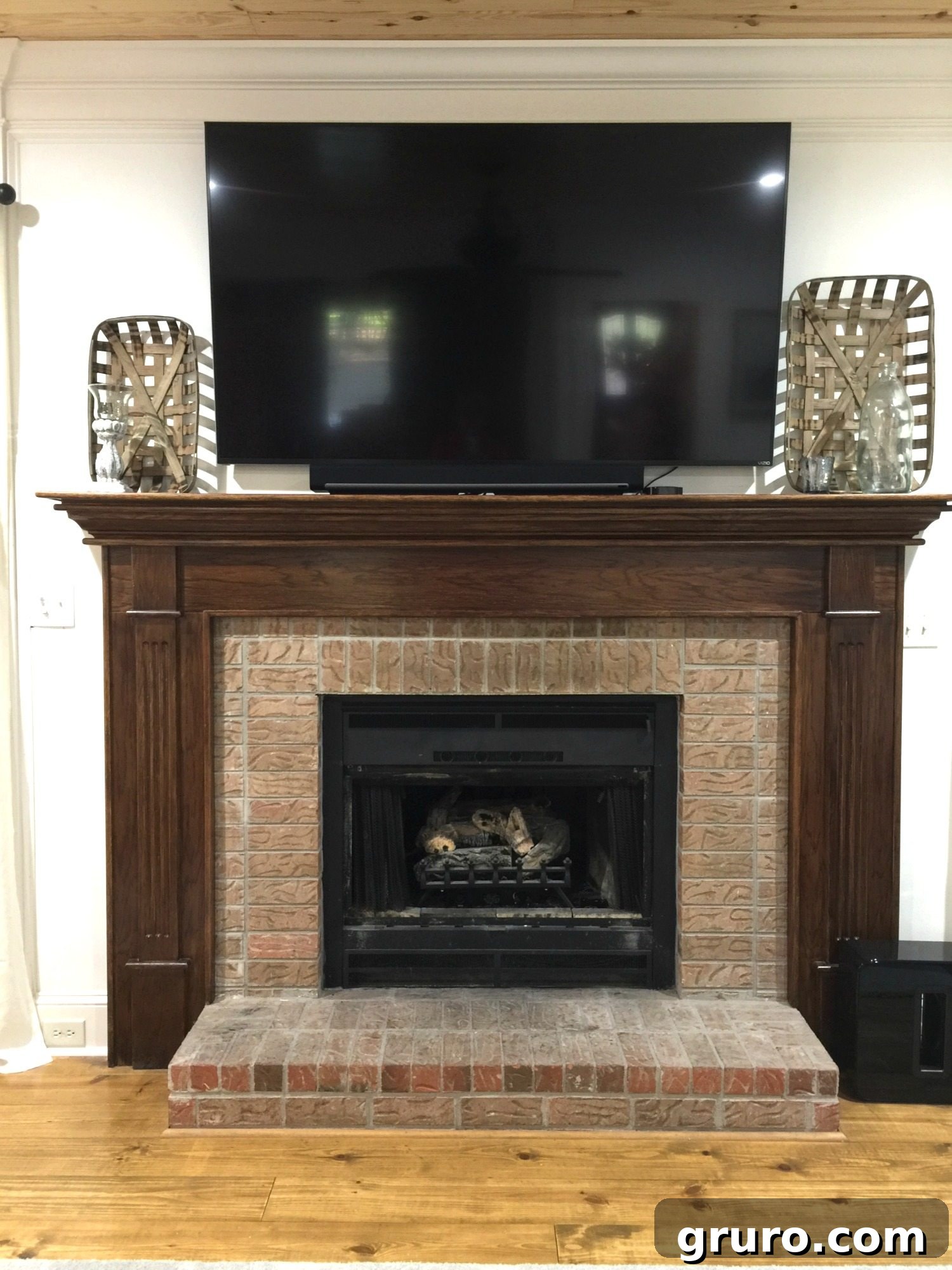 Outdated Fireplace Before Painting - Dark Brick and Wood Surround