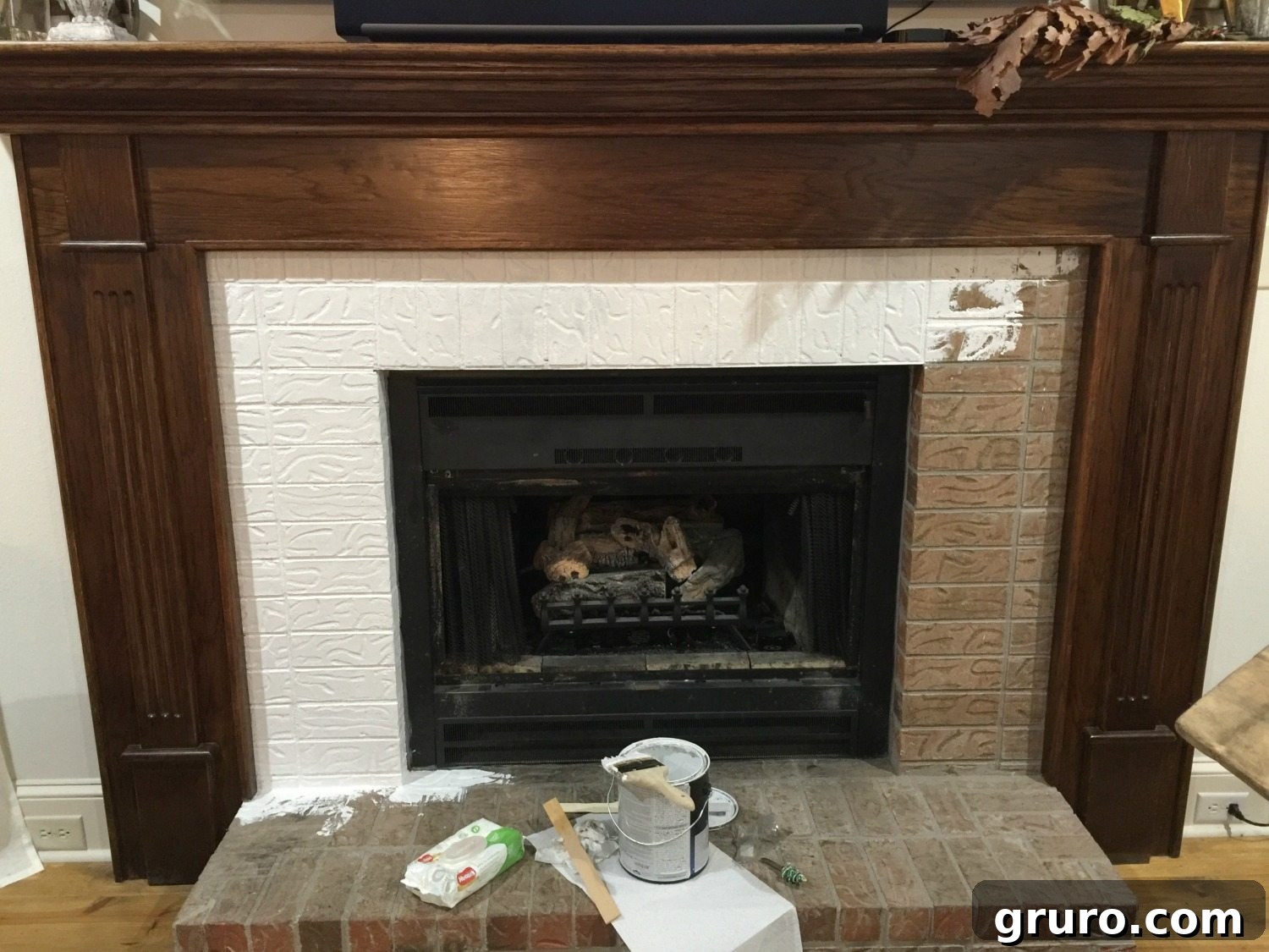 Applying Stain-Blocking Primer to Fireplace Brick and Mantel