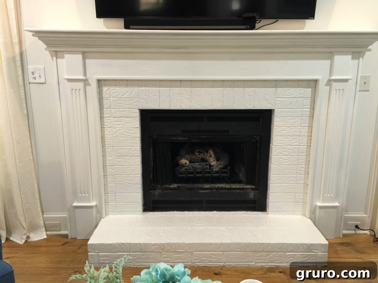 Two Coats of Paint on Transformed Fireplace Brick and Mantel
