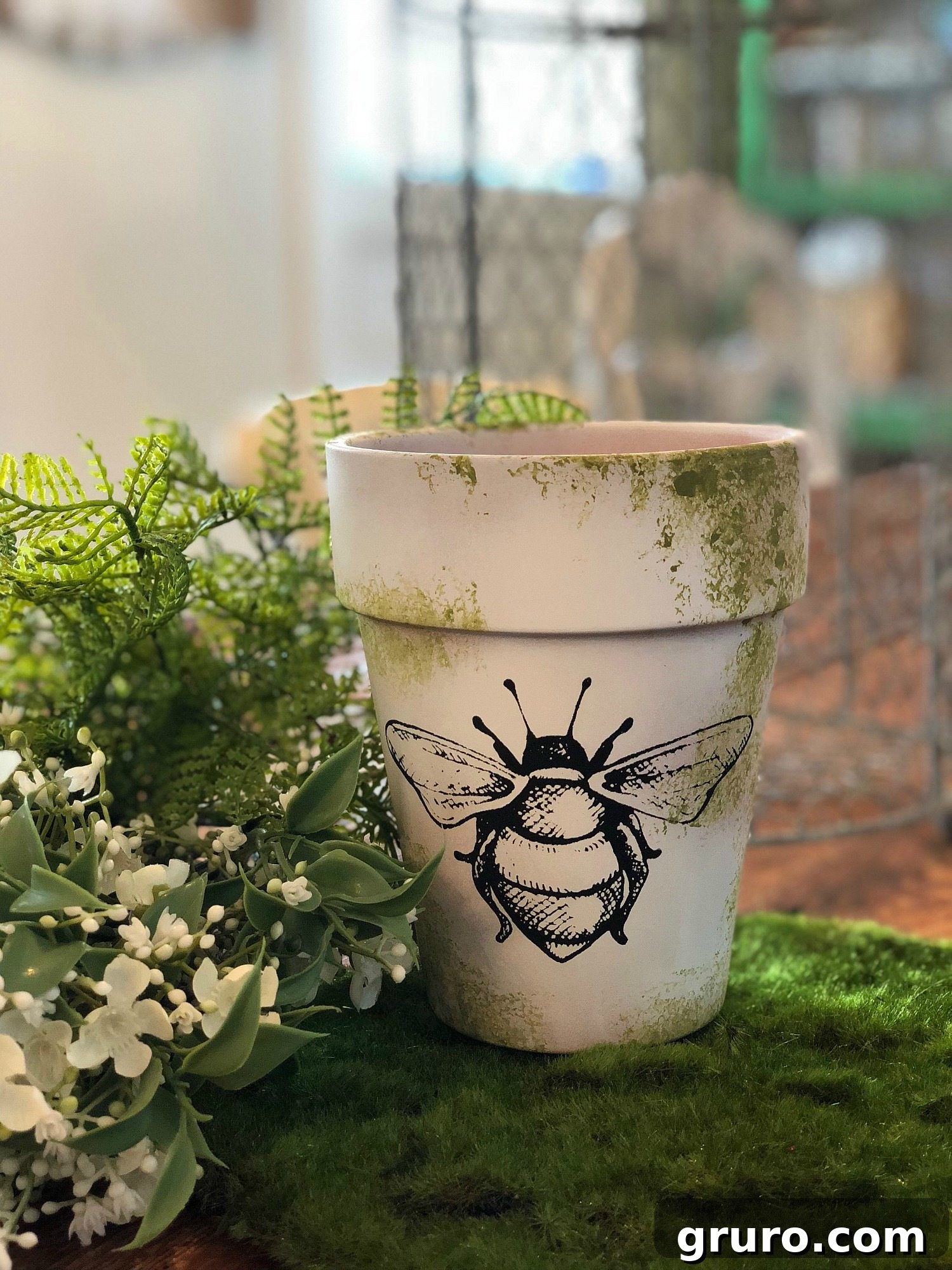 Close-up of DIY Bee and Moss Clay Pot Bee Clay Pot Makeover - Rustic Home Decor