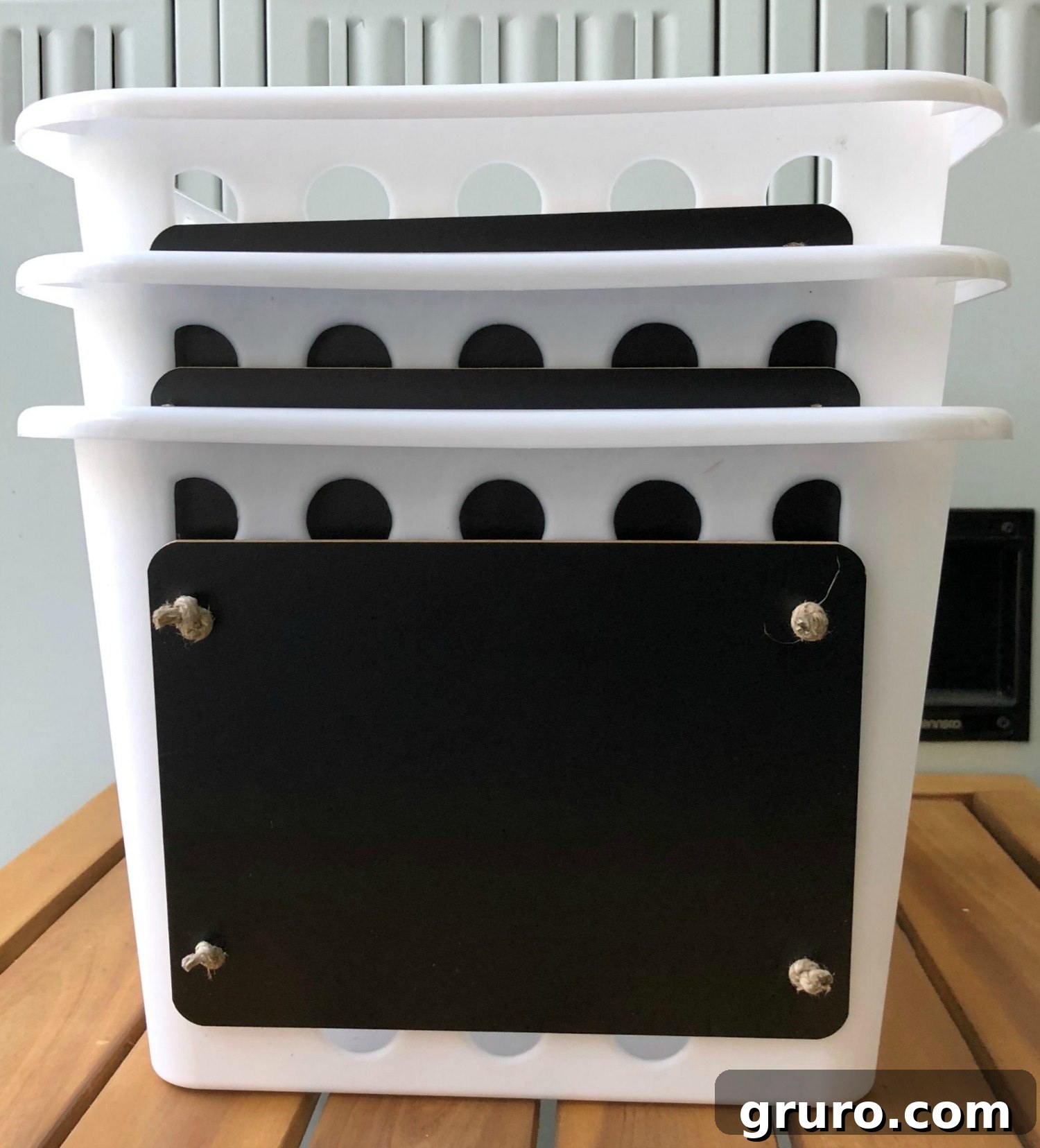Stackable plastic storage bins demonstrating space-saving feature