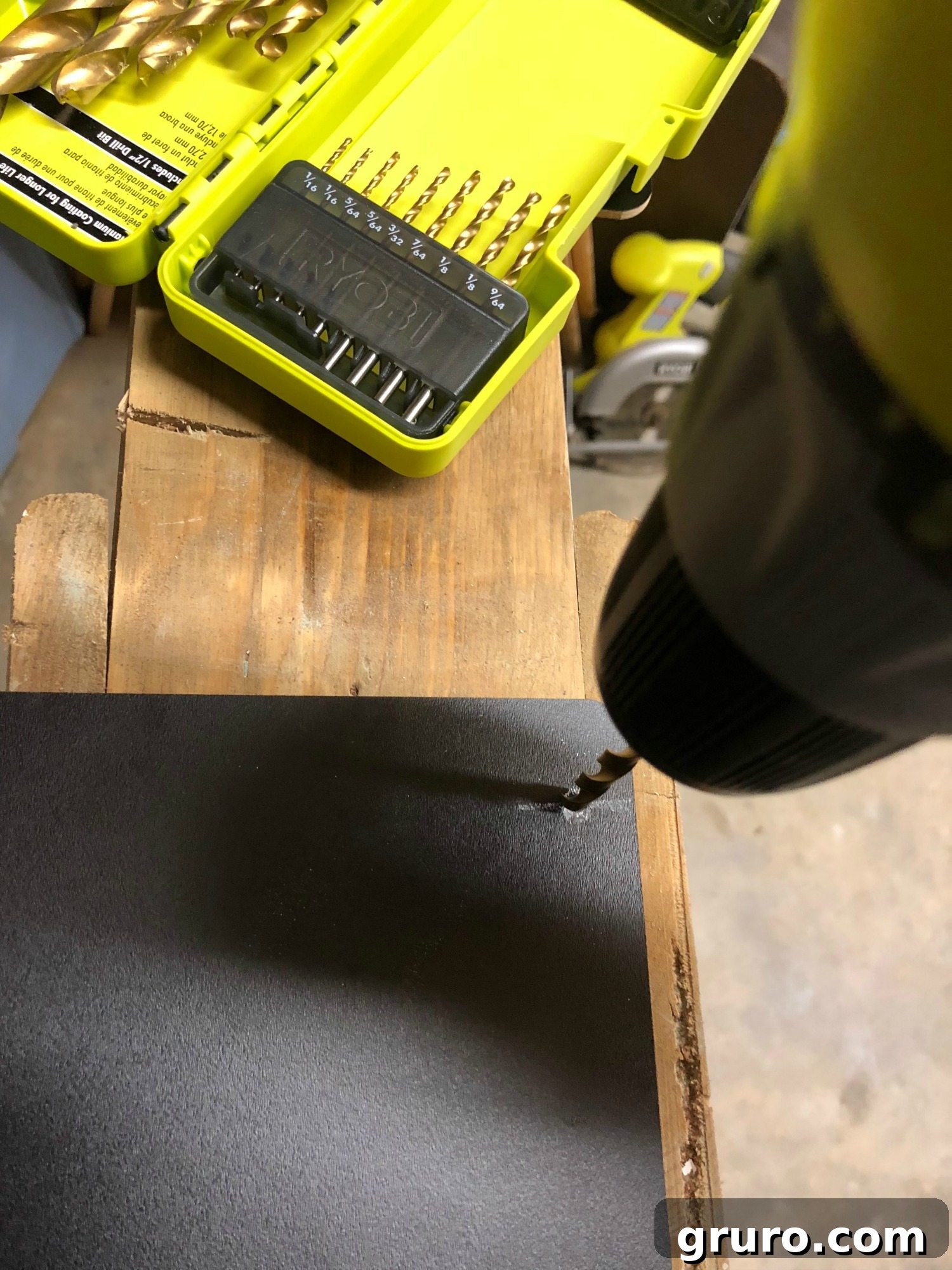 Drilling holes into a plastic storage bin for twine attachment